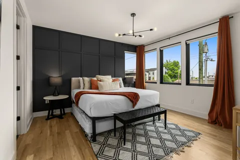 a bed room with a bed and a window
