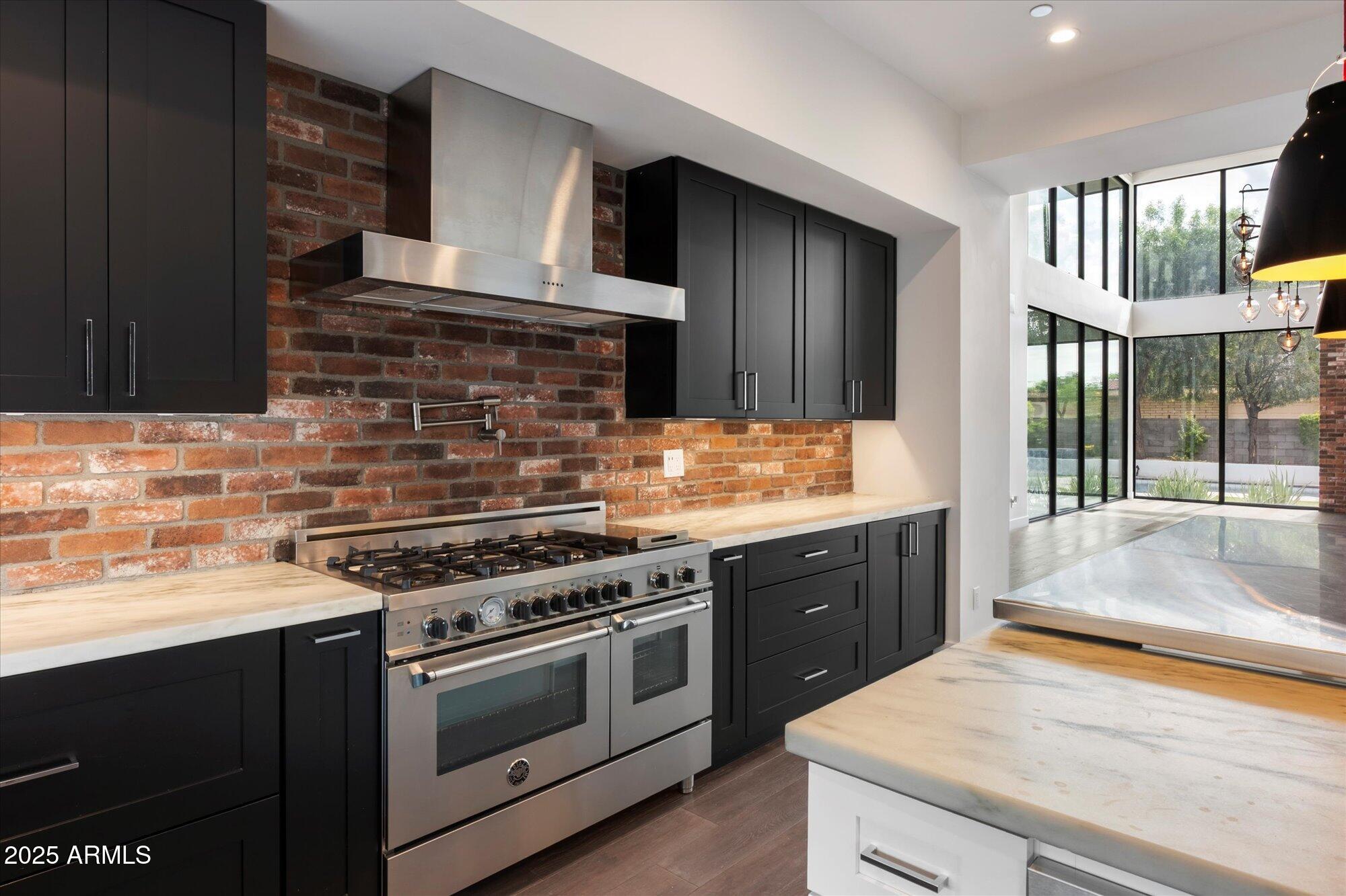 4525 North 36th Way Phoenix, AZ 85018 - Photo 15 of 40 a kitchen with a stove and a sink