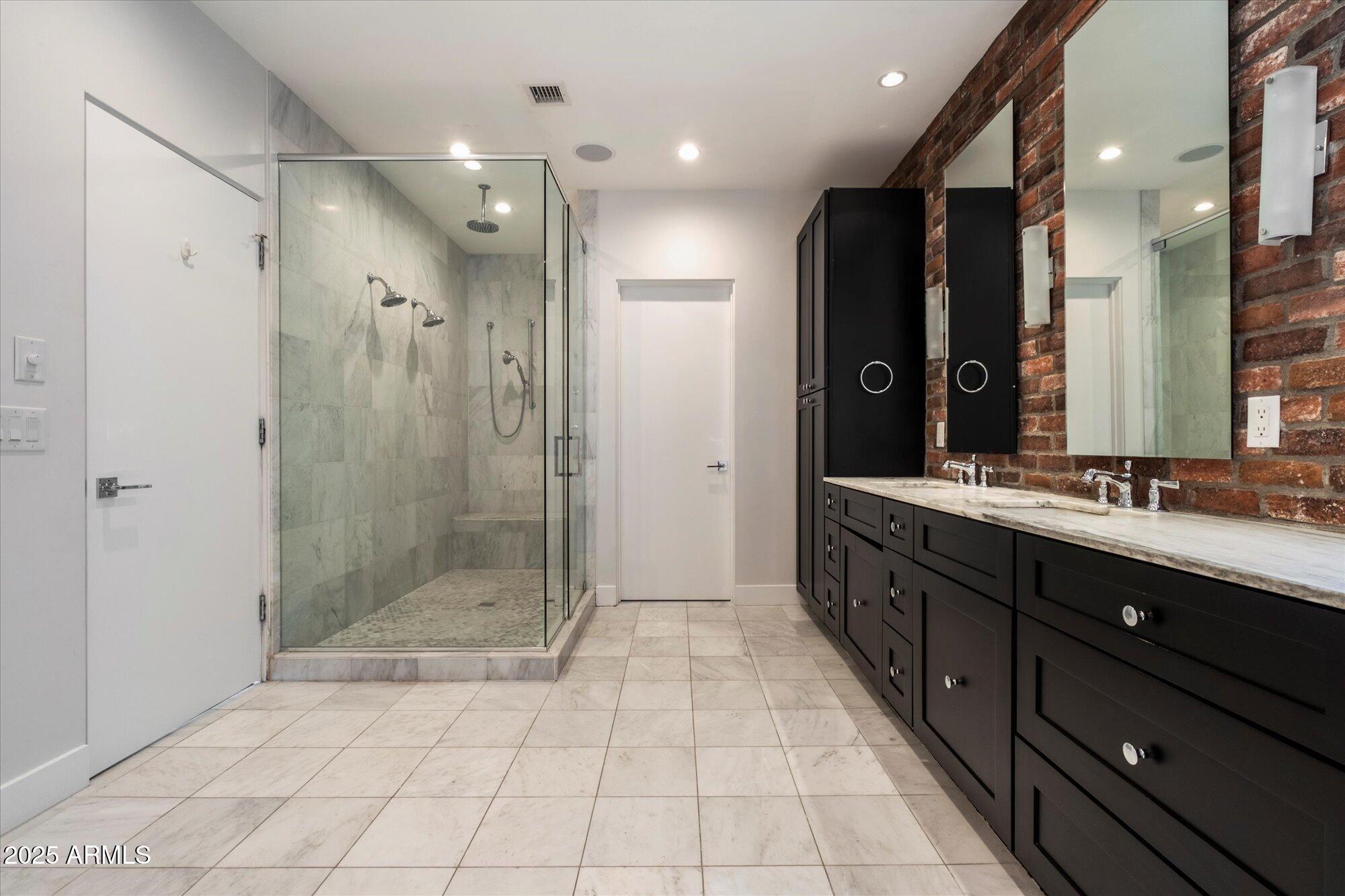 4525 North 36th Way Phoenix, AZ 85018 - Photo 21 of 40 a bathroom with a granite countertop sink mirror and shower