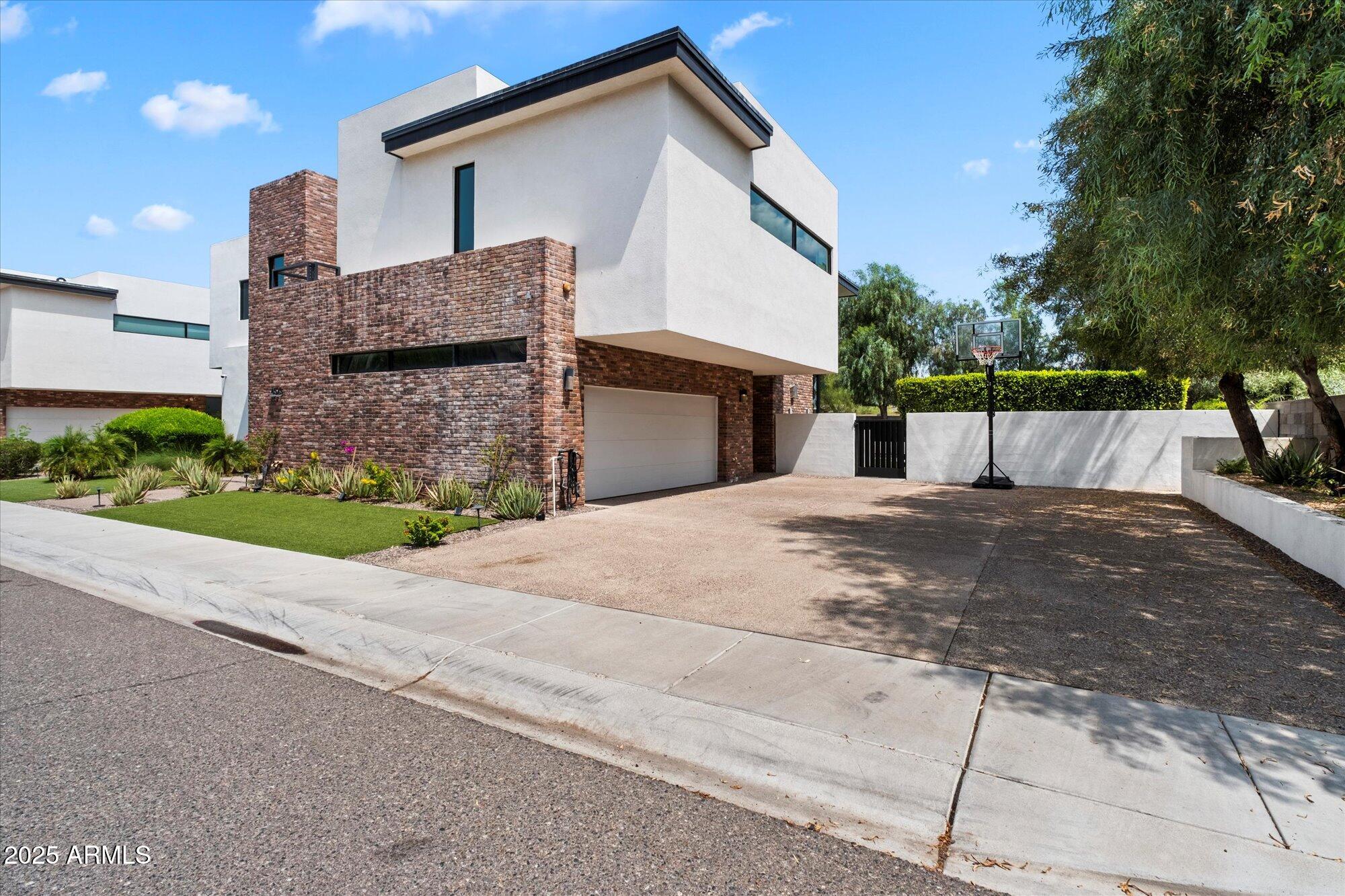 4525 North 36th Way Phoenix, AZ 85018 - Photo 3 of 40 a view of a house with a street
