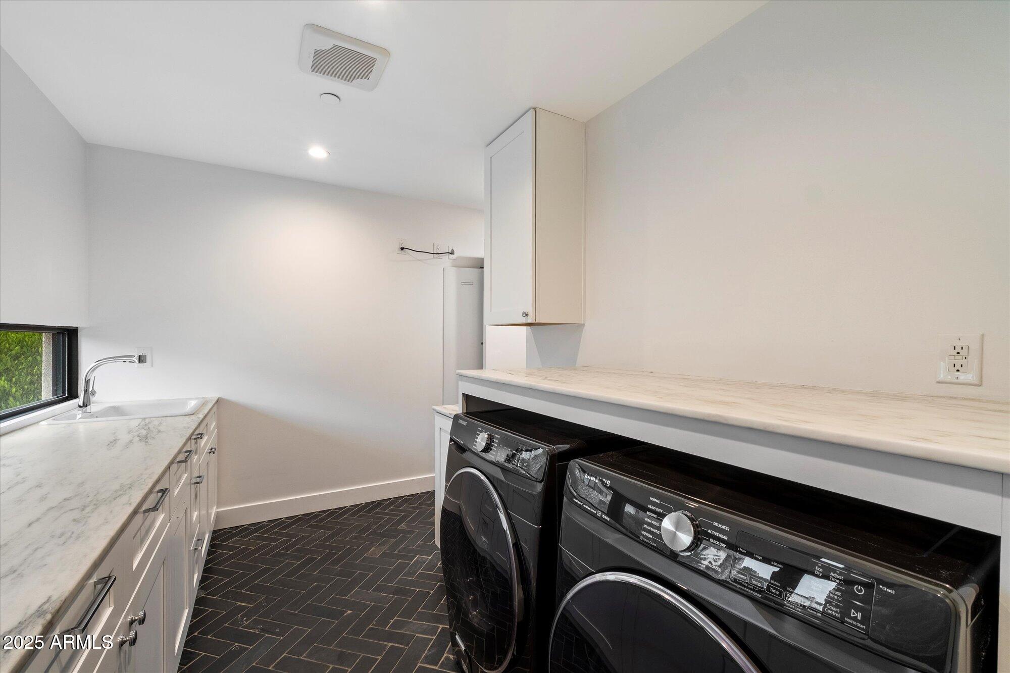 4525 North 36th Way Phoenix, AZ 85018 - Photo 34 of 40 a utility room with sink dryer and washer