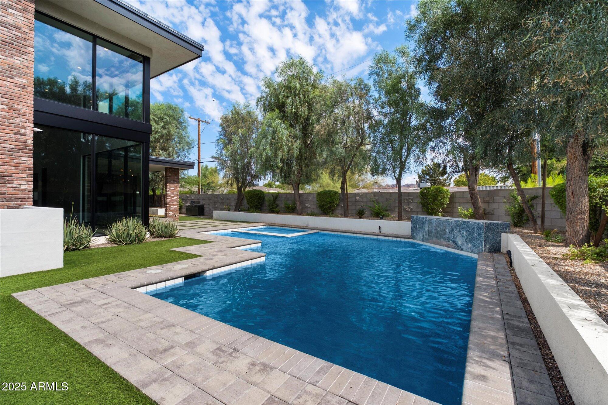 4525 North 36th Way Phoenix, AZ 85018 - Photo 36 of 40 a view of a swimming pool with a patio