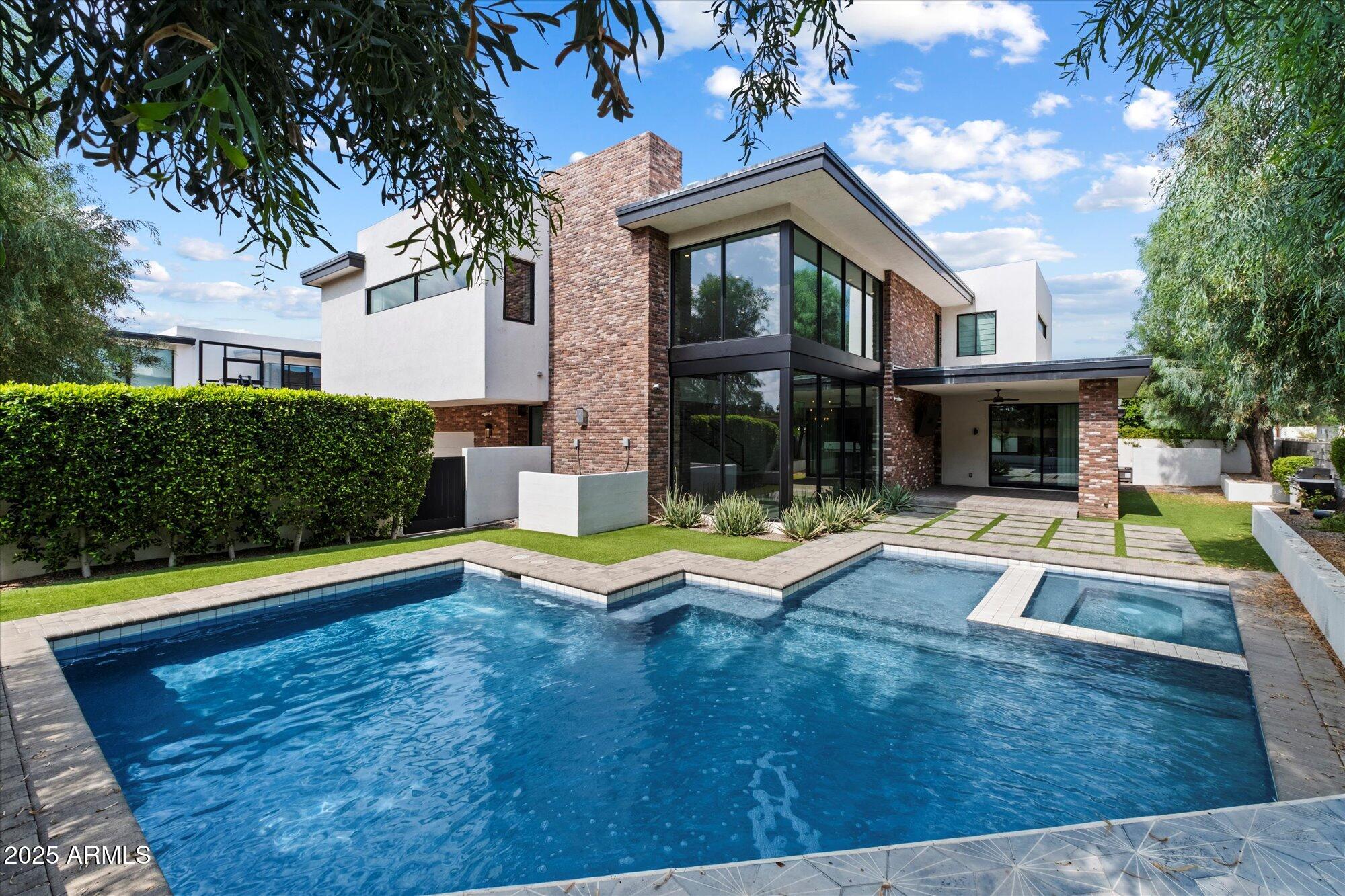 4525 North 36th Way Phoenix, AZ 85018 - Photo 38 of 40 a view of swimming pool with lawn chairs and plants