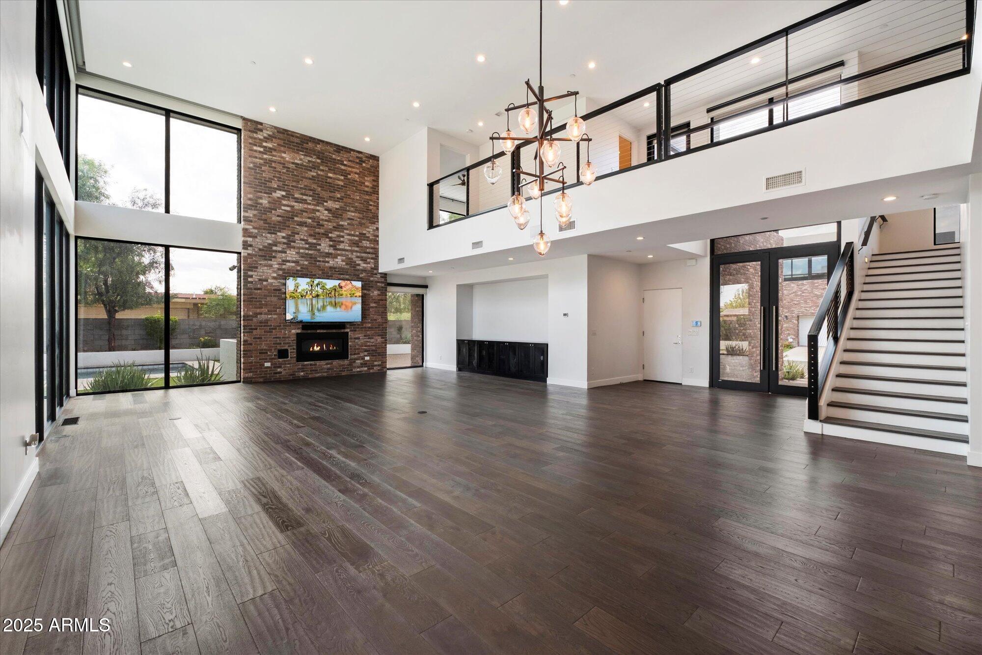 4525 North 36th Way Phoenix, AZ 85018 - Photo 10 of 40 a view of a living room with hardwood floor and a ceiling fan