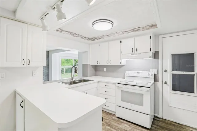 a bathroom with a bathtub shower sink mirror and toilet