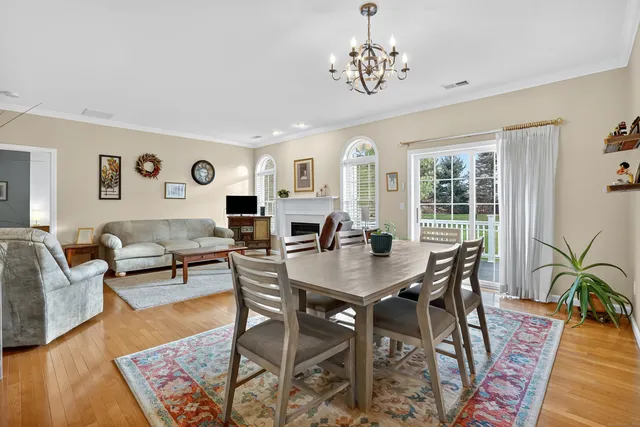 a living room with furniture fireplace and window