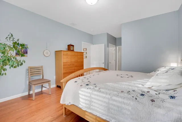 a bathroom with a double vanity sink toilet and a mirror
