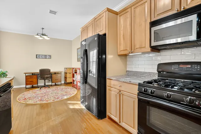 a spacious bathroom with stainless steel appliances granite countertop a sink and a granite counter tops