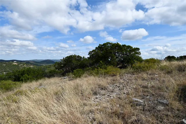 a view of a lake with green space