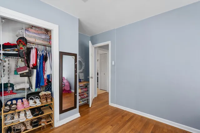 a view of a livingroom with furniture and closet