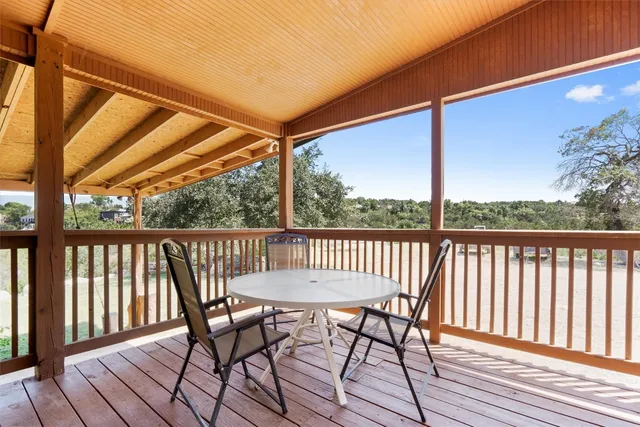 a view of a two chairs on the deck