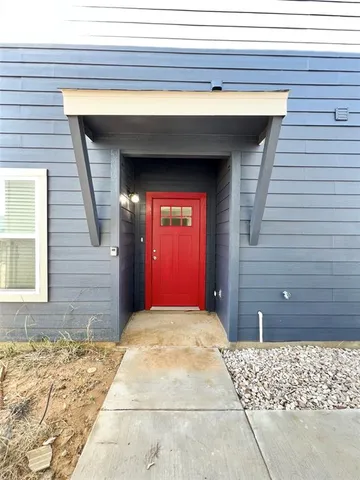a view of a wooden door of the house