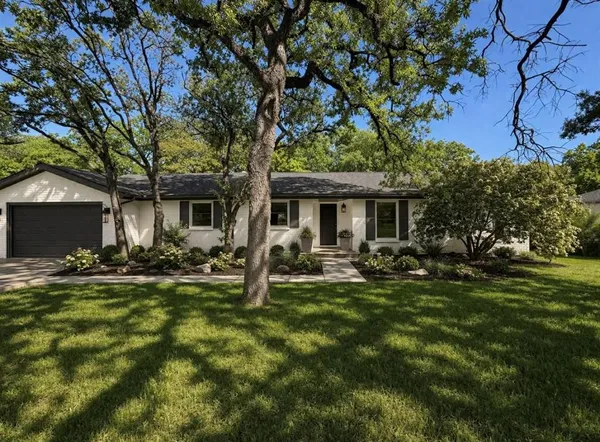 a view of a house with backyard porch and sitting area