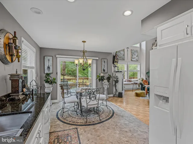 a living room with furniture large window and flat screen tv