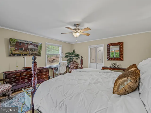 a bed room with a bed and a television