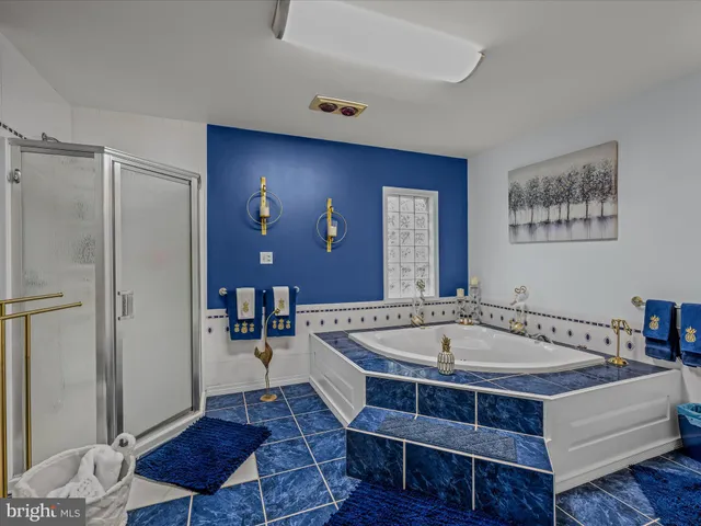 a living room with a table chairs and a wooden floor