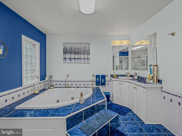 a view of a kitchen with granite countertop a sink and a stove top oven