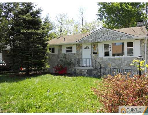 473 Chain O' Hills Road Colonia, NJ 07067 - Photo 1 of 10 a front view of a house with a yard