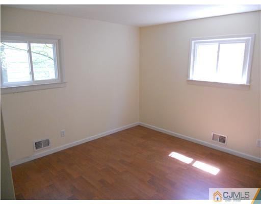 473 Chain O' Hills Road Colonia, NJ 07067 - Photo 3 of 10 an empty room with a window