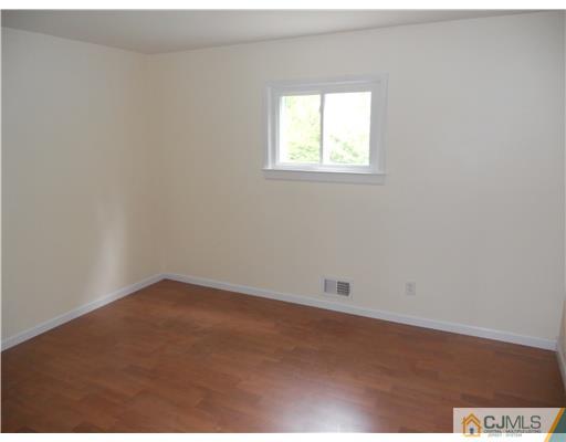 473 Chain O' Hills Road Colonia, NJ 07067 - Photo 4 of 10 an empty room with a window