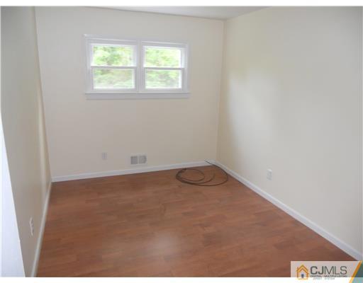 473 Chain O' Hills Road Colonia, NJ 07067 - Photo 5 of 10 an empty room with a window
