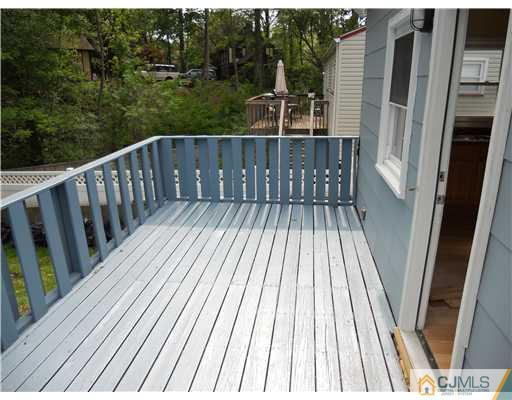 473 Chain O' Hills Road Colonia, NJ 07067 - Photo 9 of 10 a view of balcony with wooden floor and fence