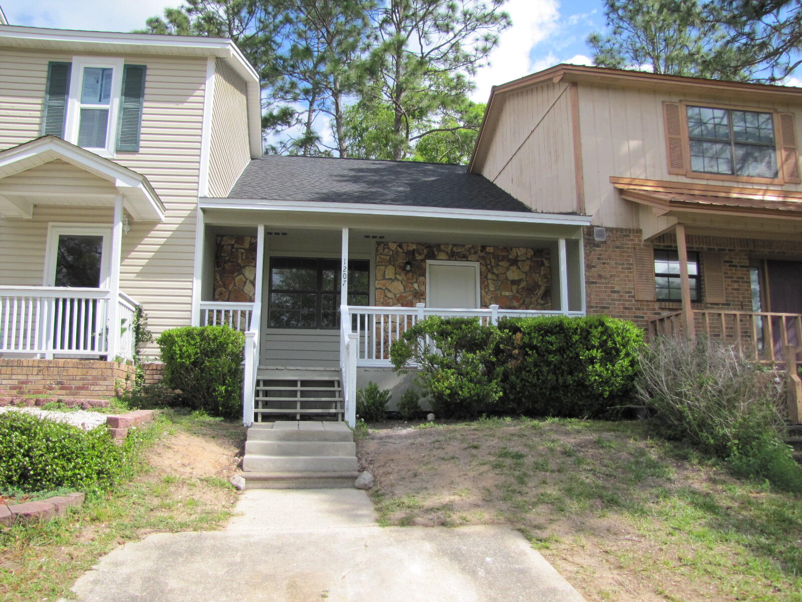 a front view of a house with a yard
