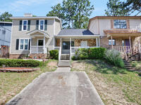 1207 Walter Avenue Crestview, FL 32536 - Photo 2 of 23 a front view of a house with garden