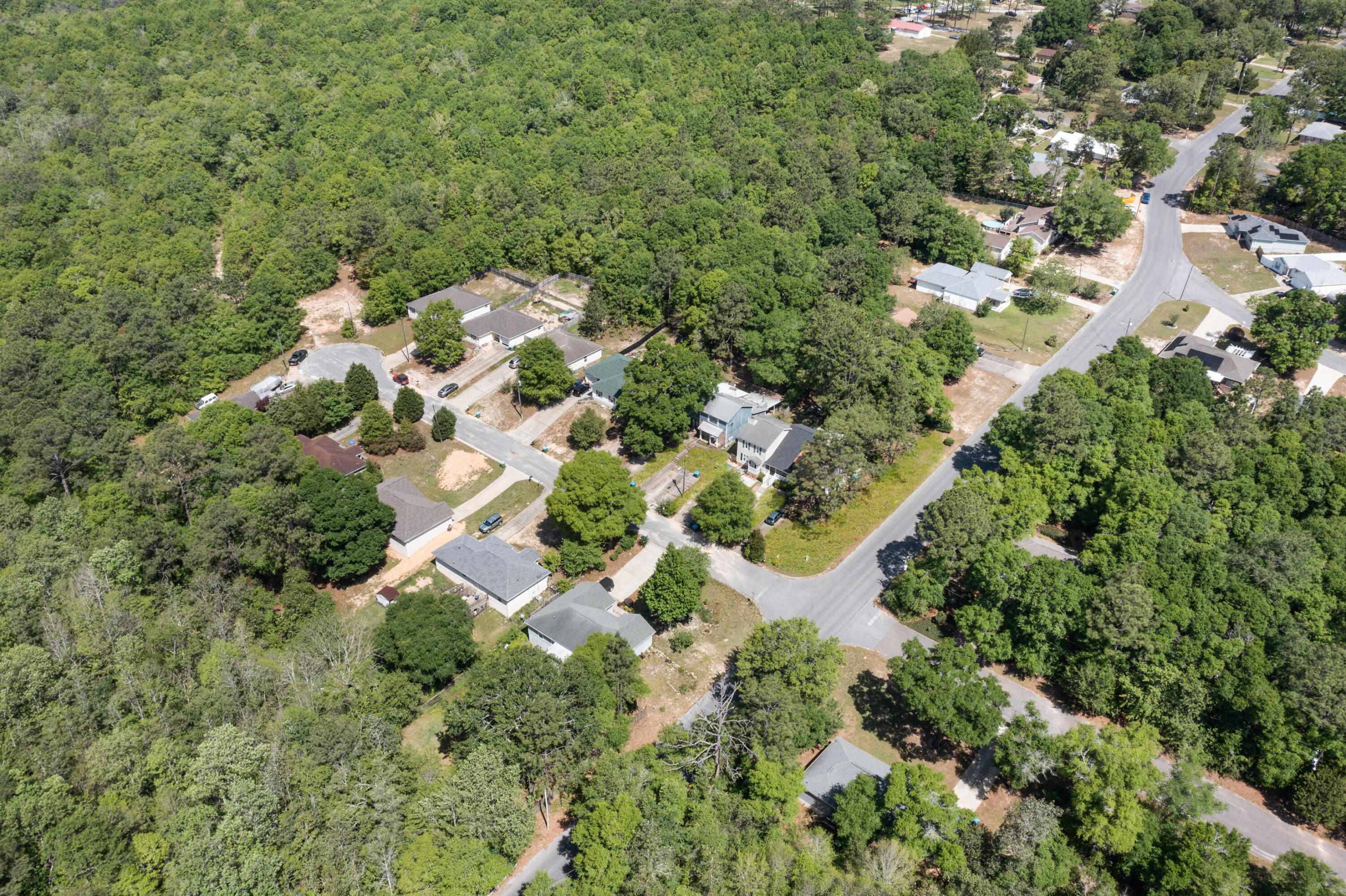 1207 Walter Avenue Crestview, FL 32536 - Photo 23 of 23 an aerial view of residential house with outdoor space and trees all around