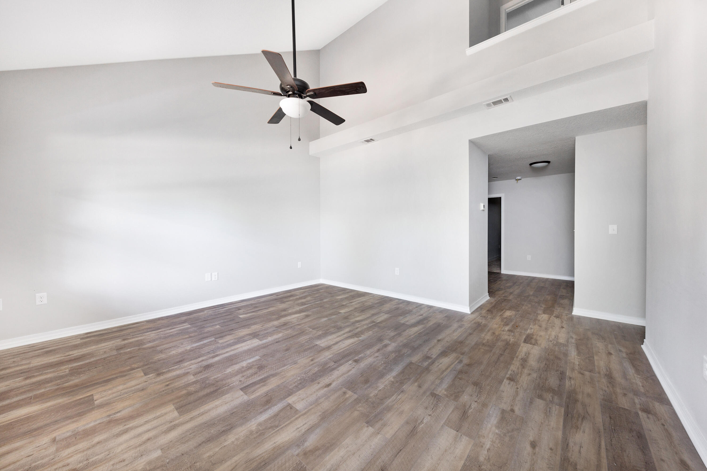 1207 Walter Avenue Crestview, FL 32536 - Photo 4 of 23 a view of empty room with wooden floor
