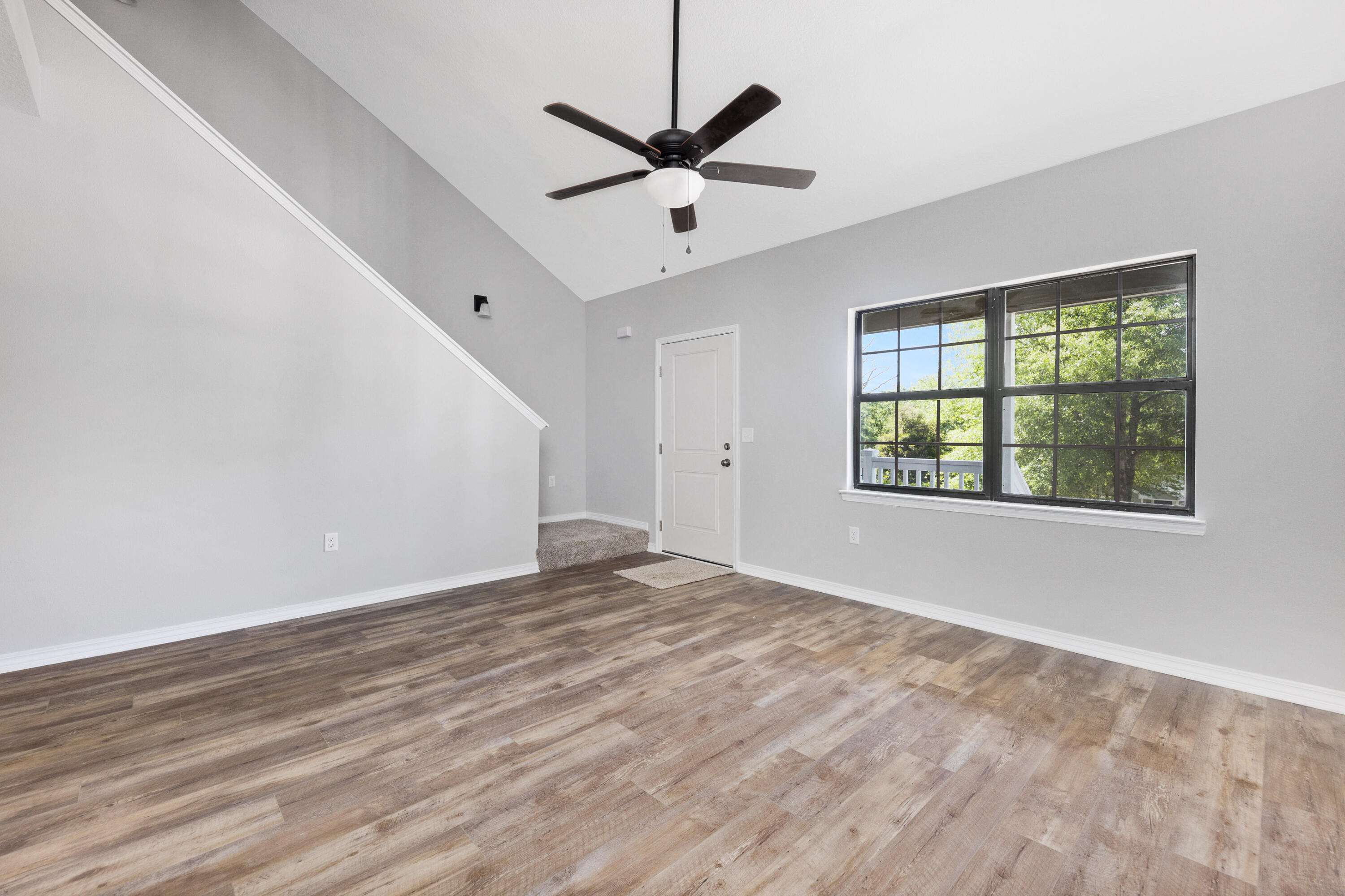 1207 Walter Avenue Crestview, FL 32536 - Photo 6 of 23 a view of an empty room with window and a ceiling fan