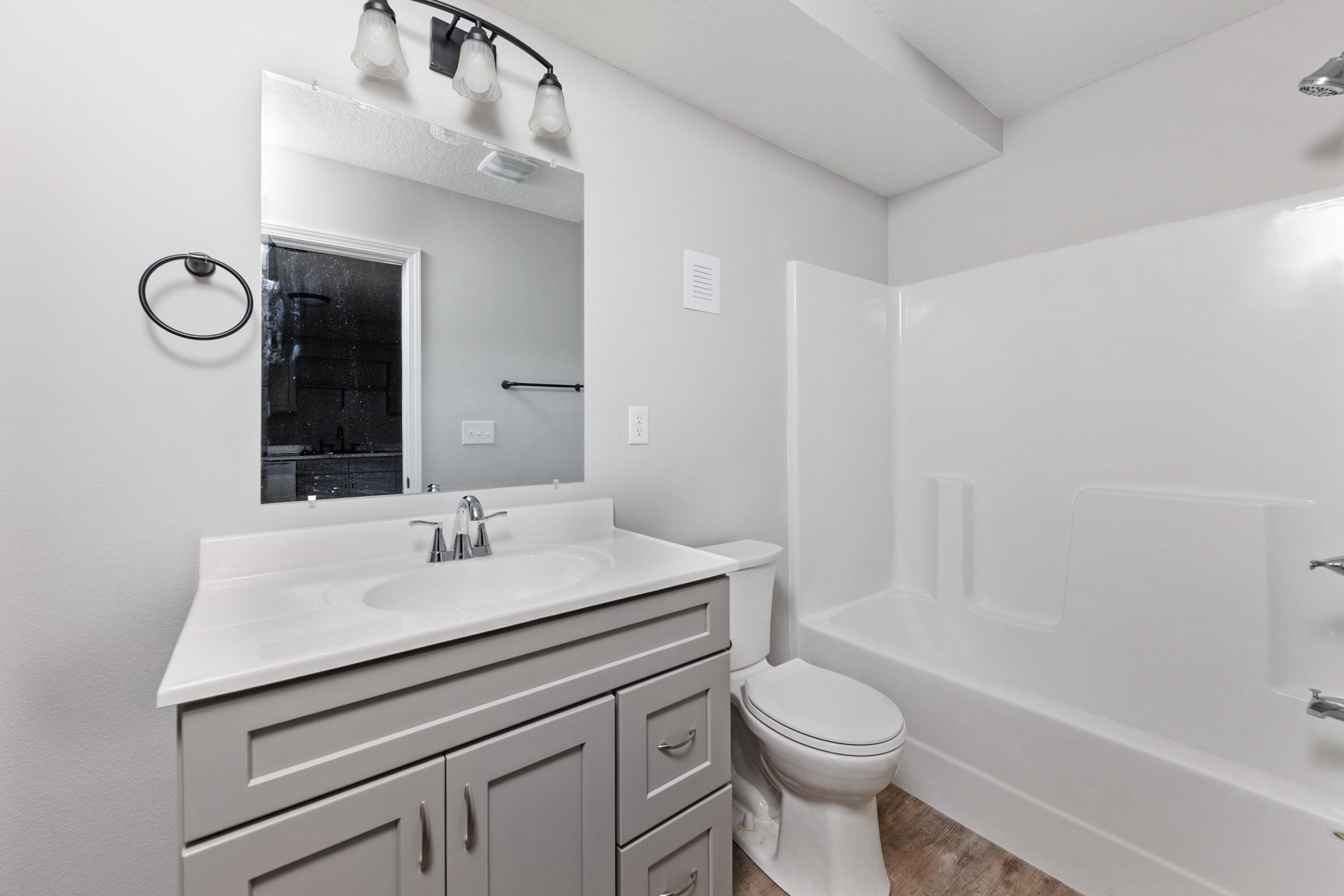 1207 Walter Avenue Crestview, FL 32536 - Photo 10 of 23 a bathroom with a sink a toilet and shower