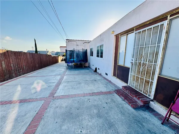 a kitchen with stainless steel appliances a sink a stove cabinets counter space and a window