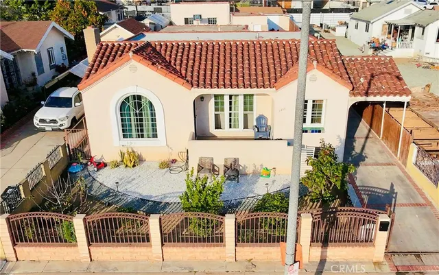 a view of a house with a wooden deck