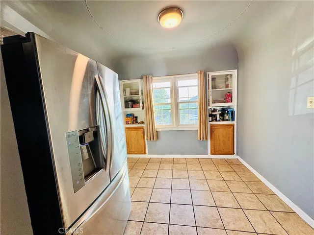 a bedroom with a bed and flat screen tv