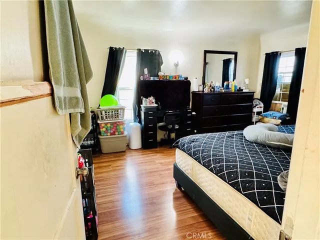 a bedroom with a bed and a mirror