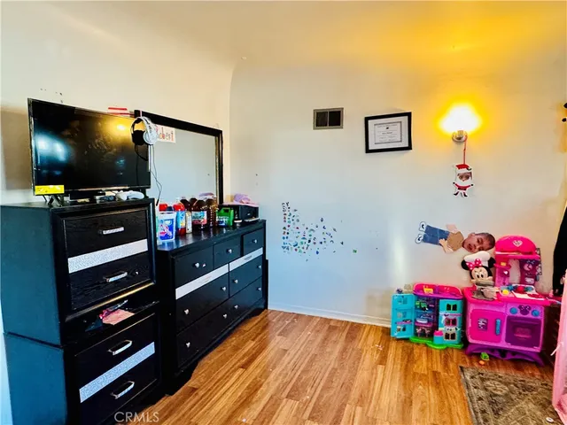 a bathroom with a sink a toilet and shower curtain