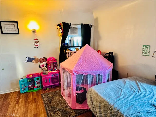 a bedroom with bed and a closet