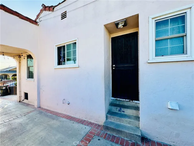 a view of a living room and entryway