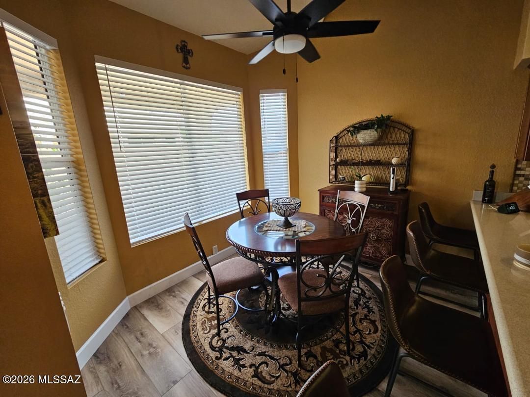 3130 West Star Ranch Trail Tucson, AZ 85742 - Photo 19 of 44 a dining room with furniture and window