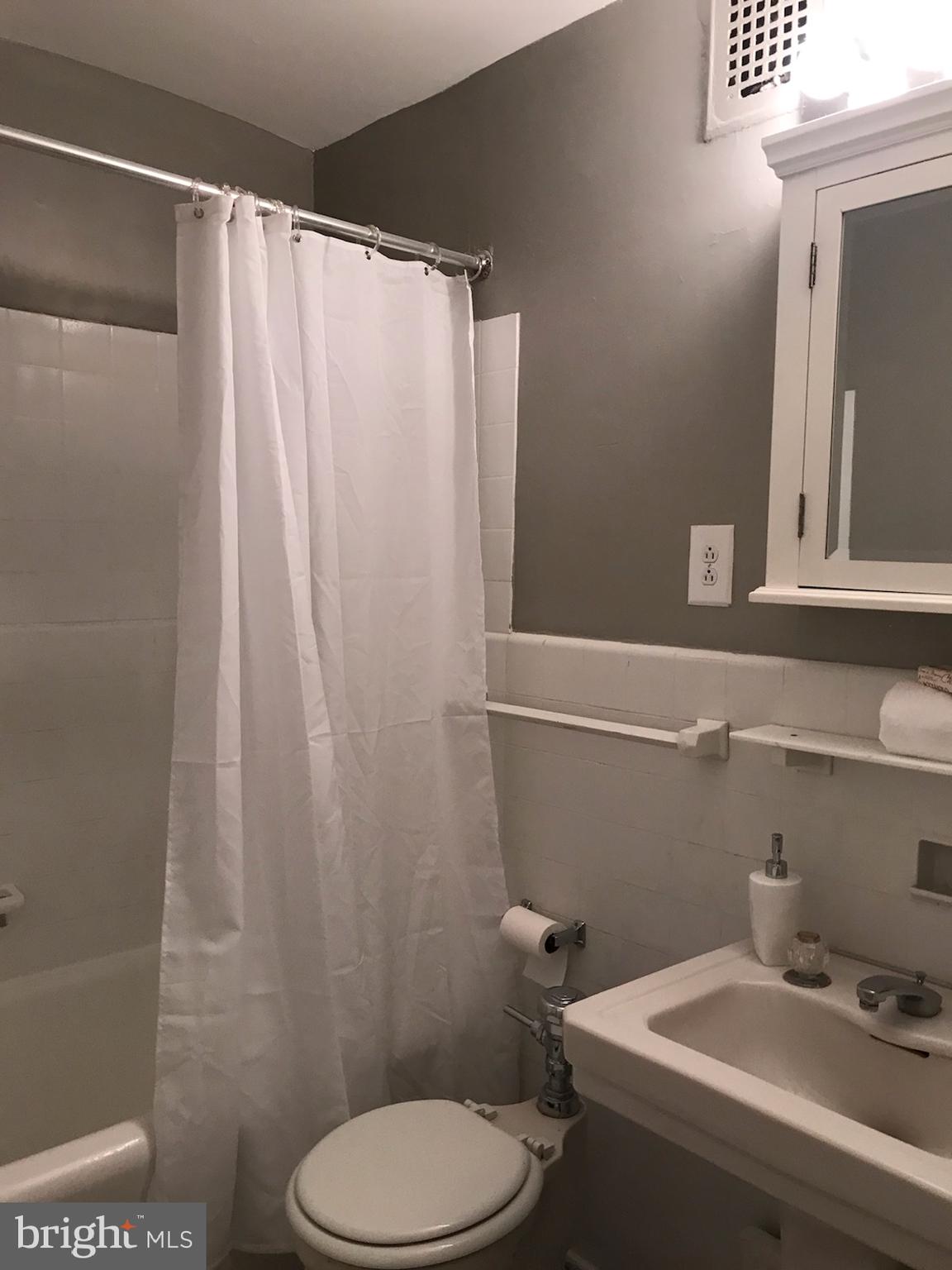 2031 Locust Street, Unit 1404 Philadelphia, PA 19103 - Photo 12 of 20 a bathroom with a sink and toilet
