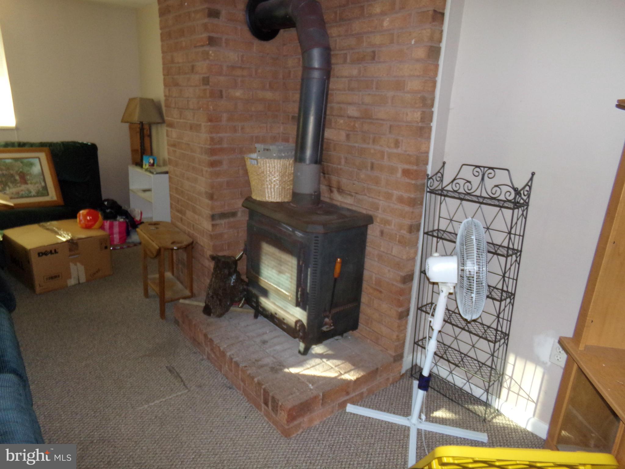 4602 Mountain Road Pasadena, MD 21122 - Photo 3 of 18 Living Room Wood Stove