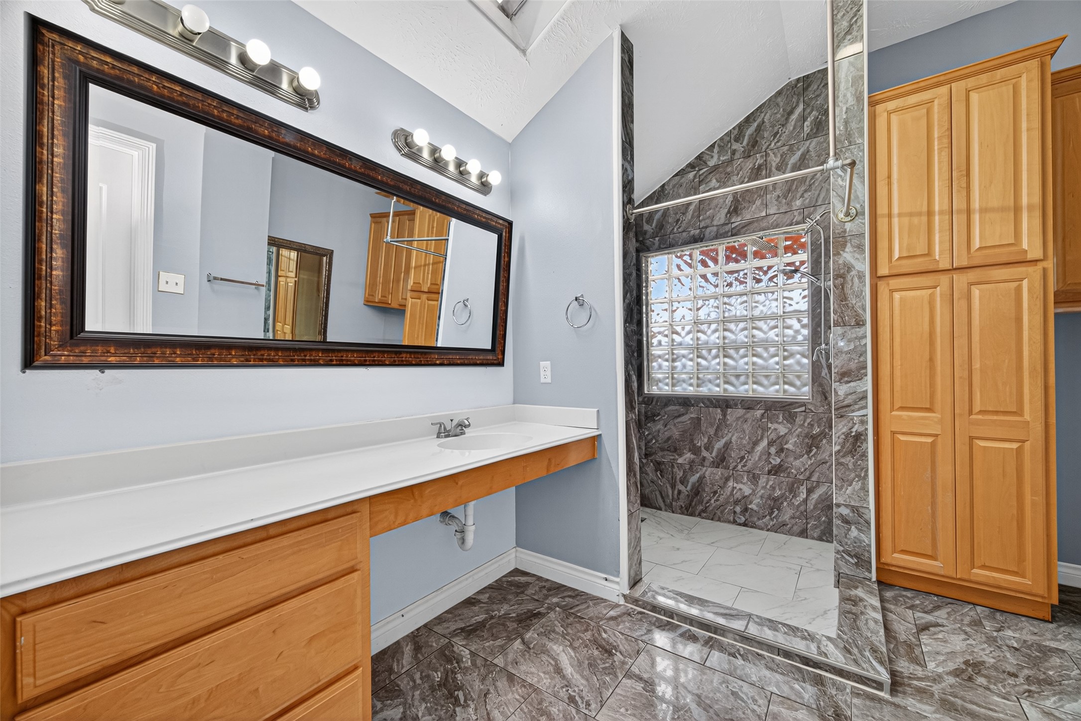 23914 Glengate Drive Spring, TX 77373 - Photo 28 of 49 a bathroom with a sink and a mirror