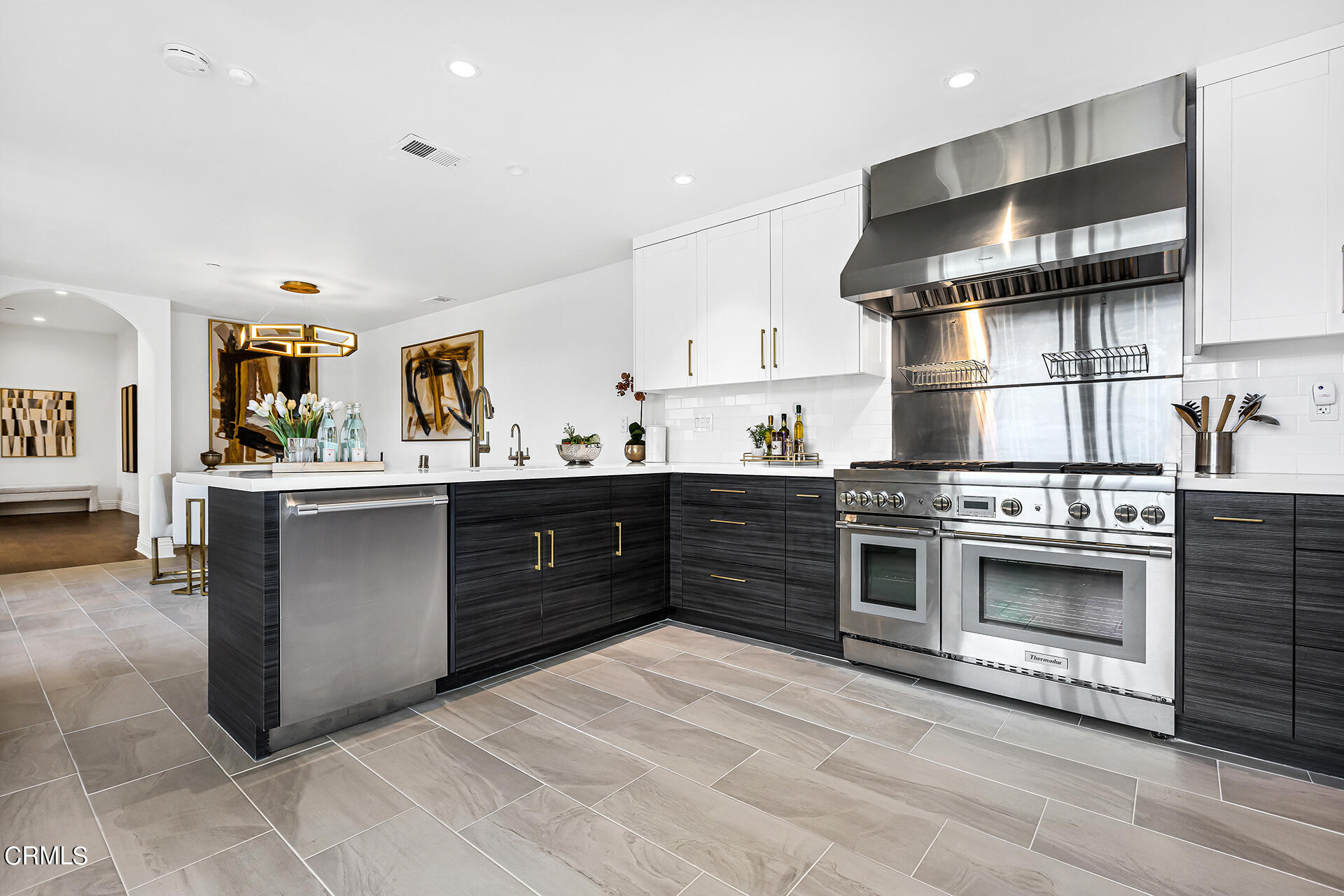 Undisclosed Address Pasadena, CA 91106 - Photo 11 of 31 a kitchen with stainless steel appliances kitchen island granite countertop a sink and a stove