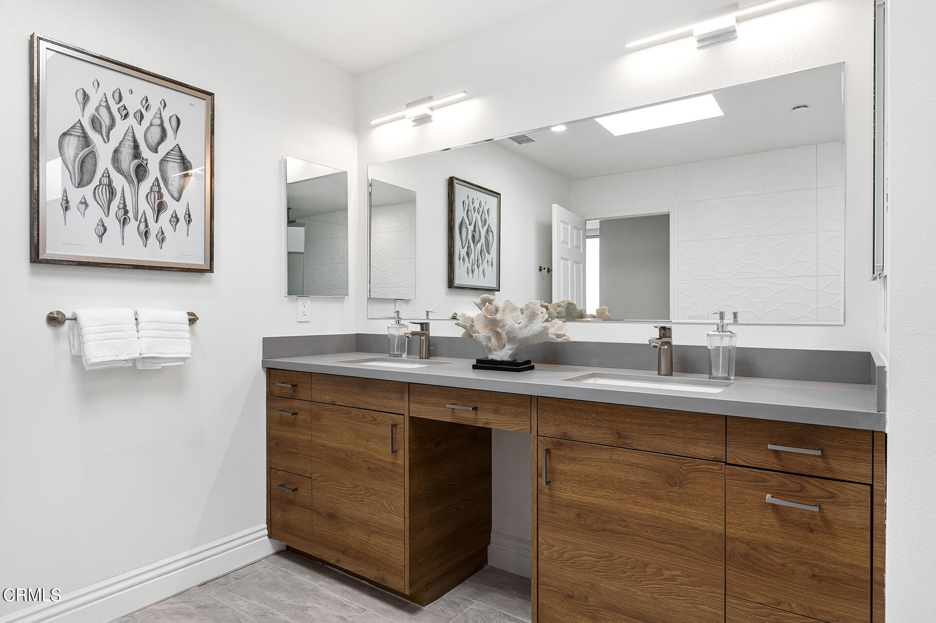 Undisclosed Address Pasadena, CA 91106 - Photo 15 of 31 a bathroom with a double vanity sink and a mirror