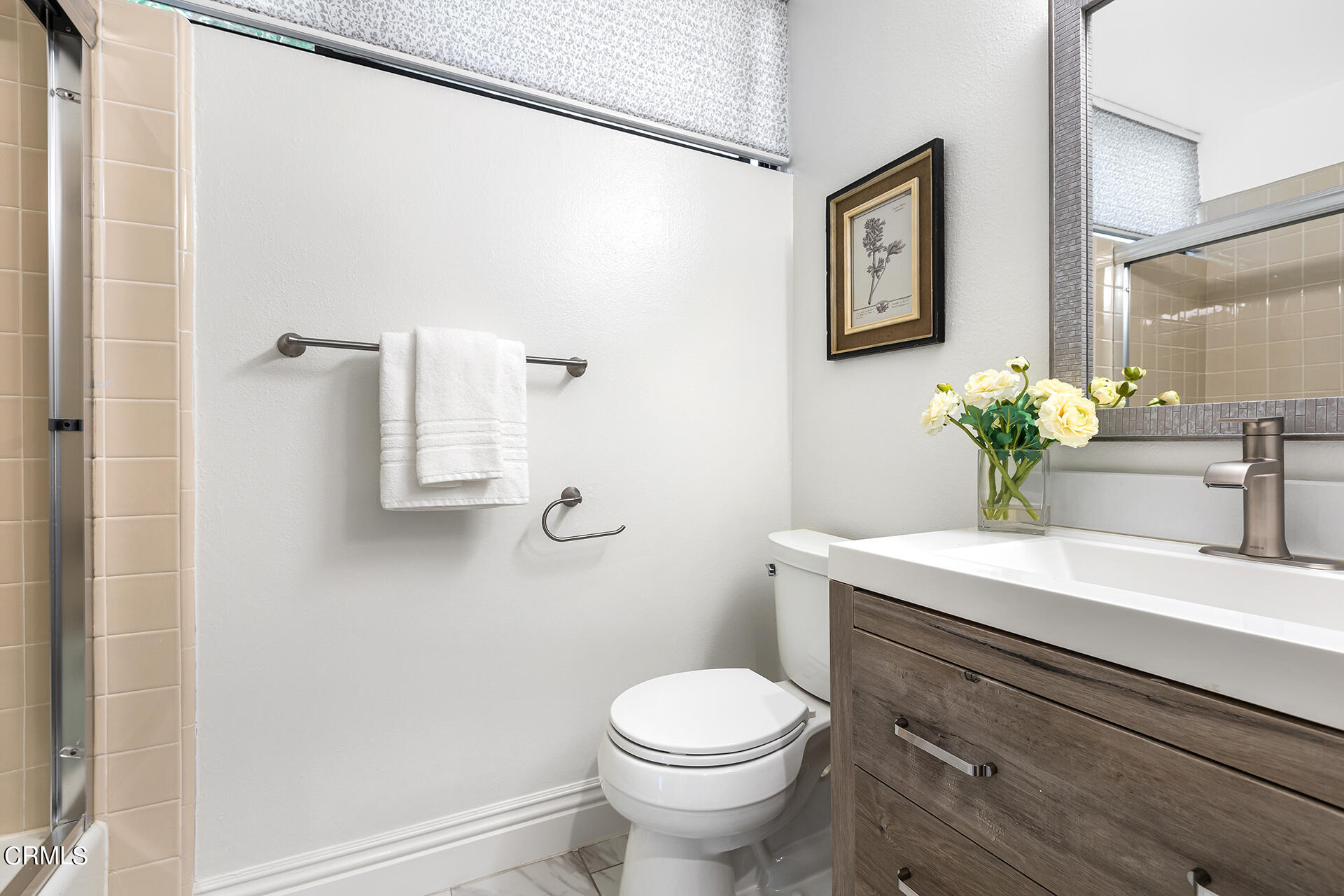 Undisclosed Address Pasadena, CA 91106 - Photo 21 of 31 a bathroom with a sink a mirror and a toilet