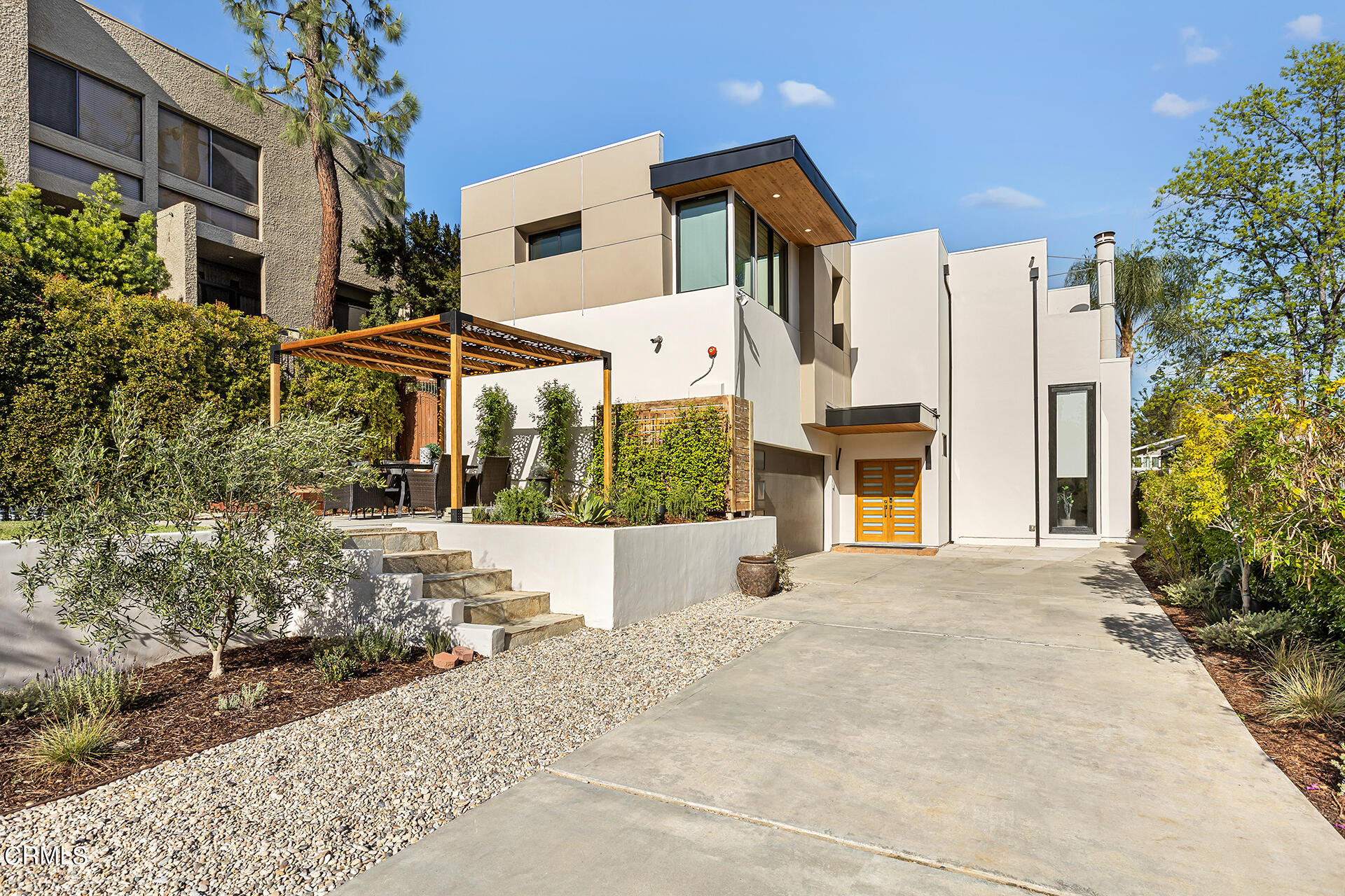 Undisclosed Address Pasadena, CA 91106 - Photo 3 of 31 a front view of a house with a yard and garage