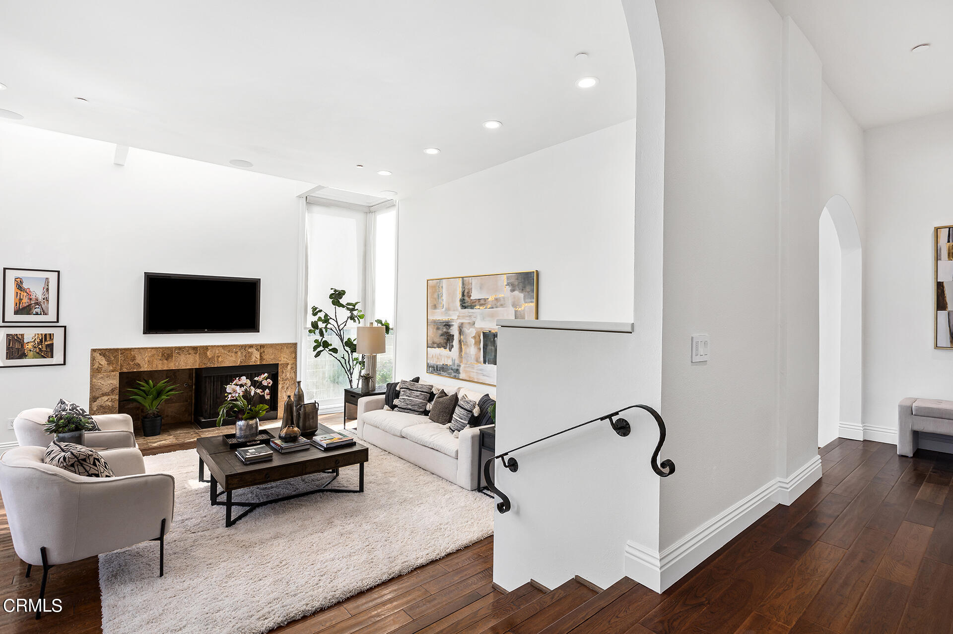 Undisclosed Address Pasadena, CA 91106 - Photo 5 of 31 a living room with furniture a flat screen tv and a fireplace