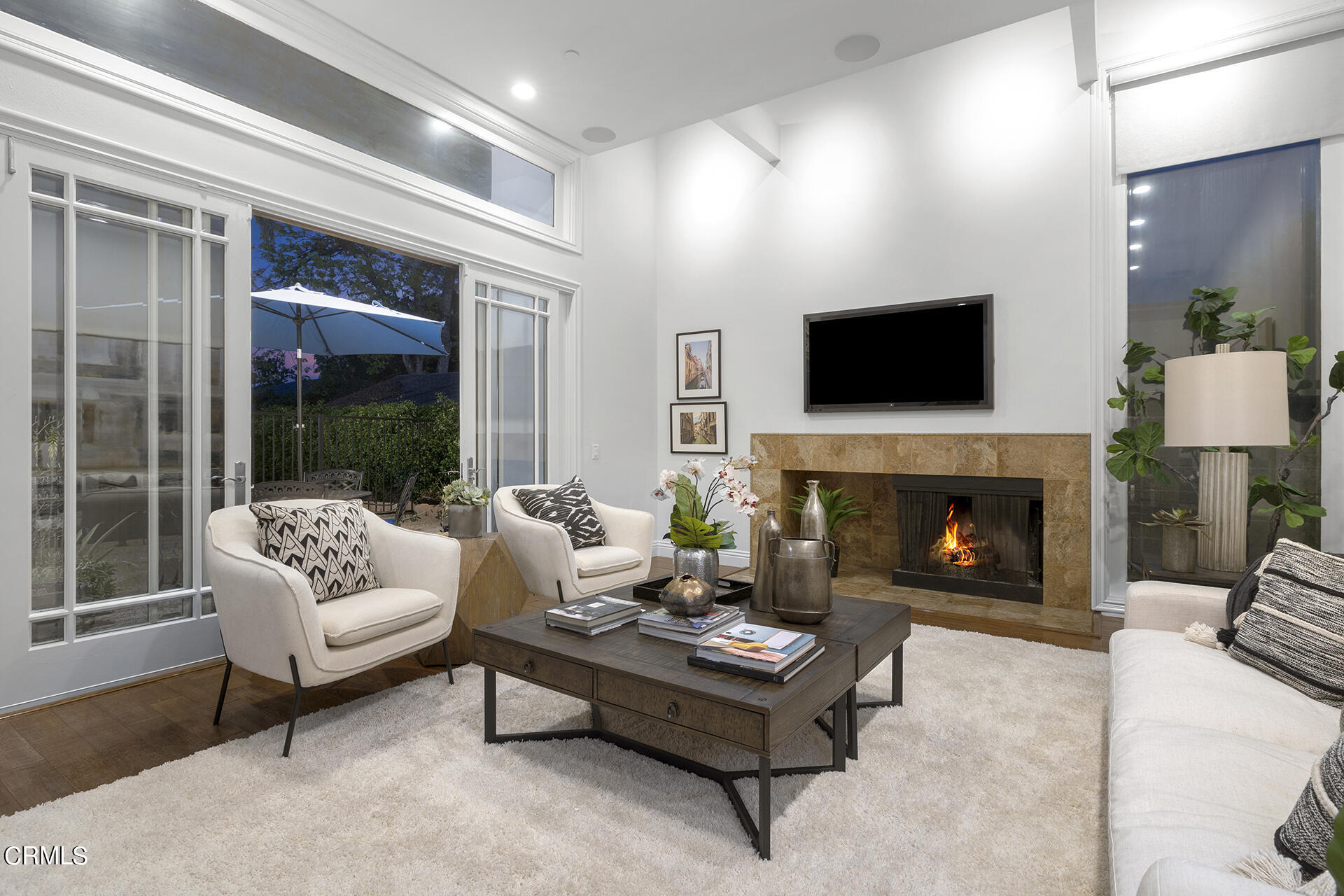 Undisclosed Address Pasadena, CA 91106 - Photo 7 of 31 a living room with furniture a flat screen tv and a fireplace