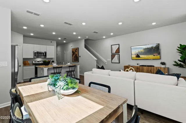 a kitchen with sink and white cabinets